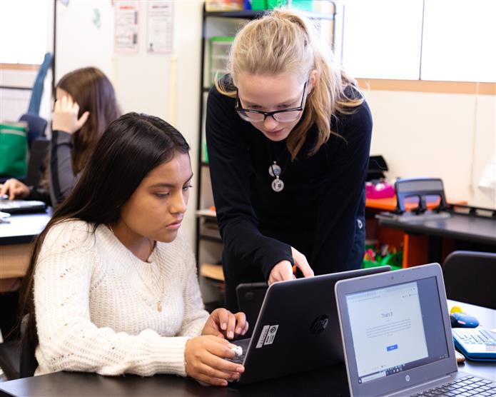 Girls looking at computer